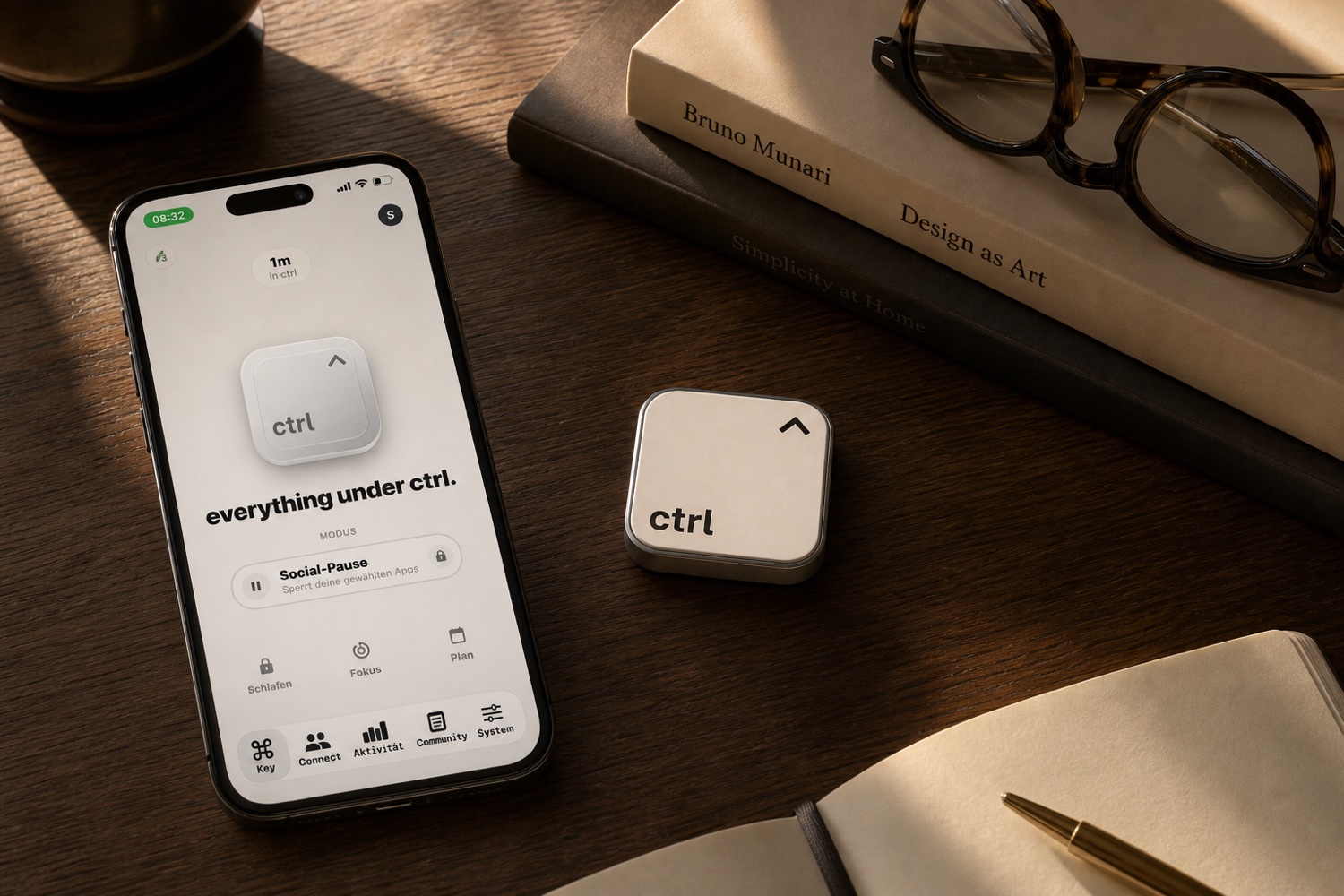 The ctrl key resting on a desk next to a stack of books